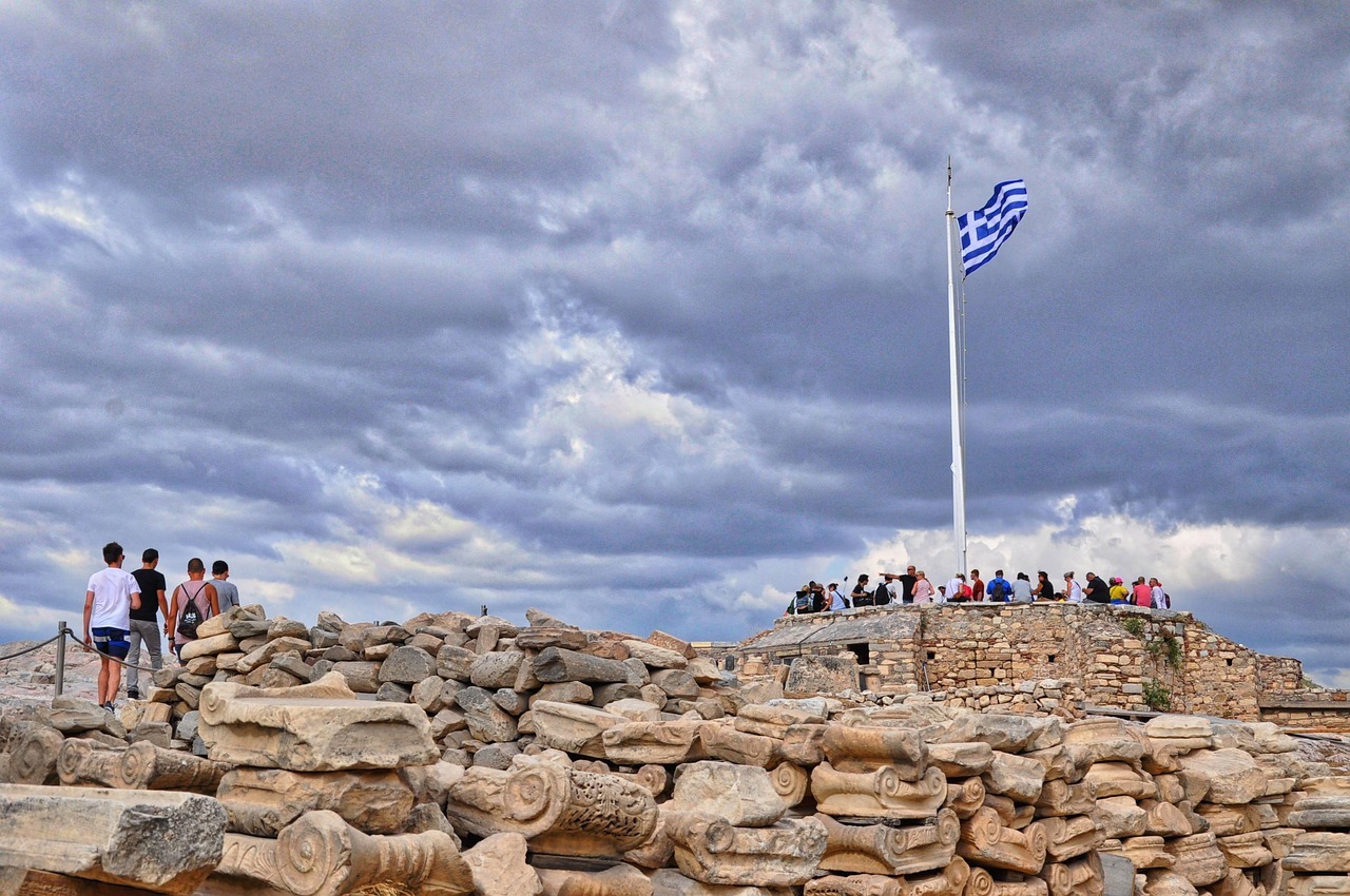 A group of people standing on top of a stone structure
AI-generated content may be incorrect.