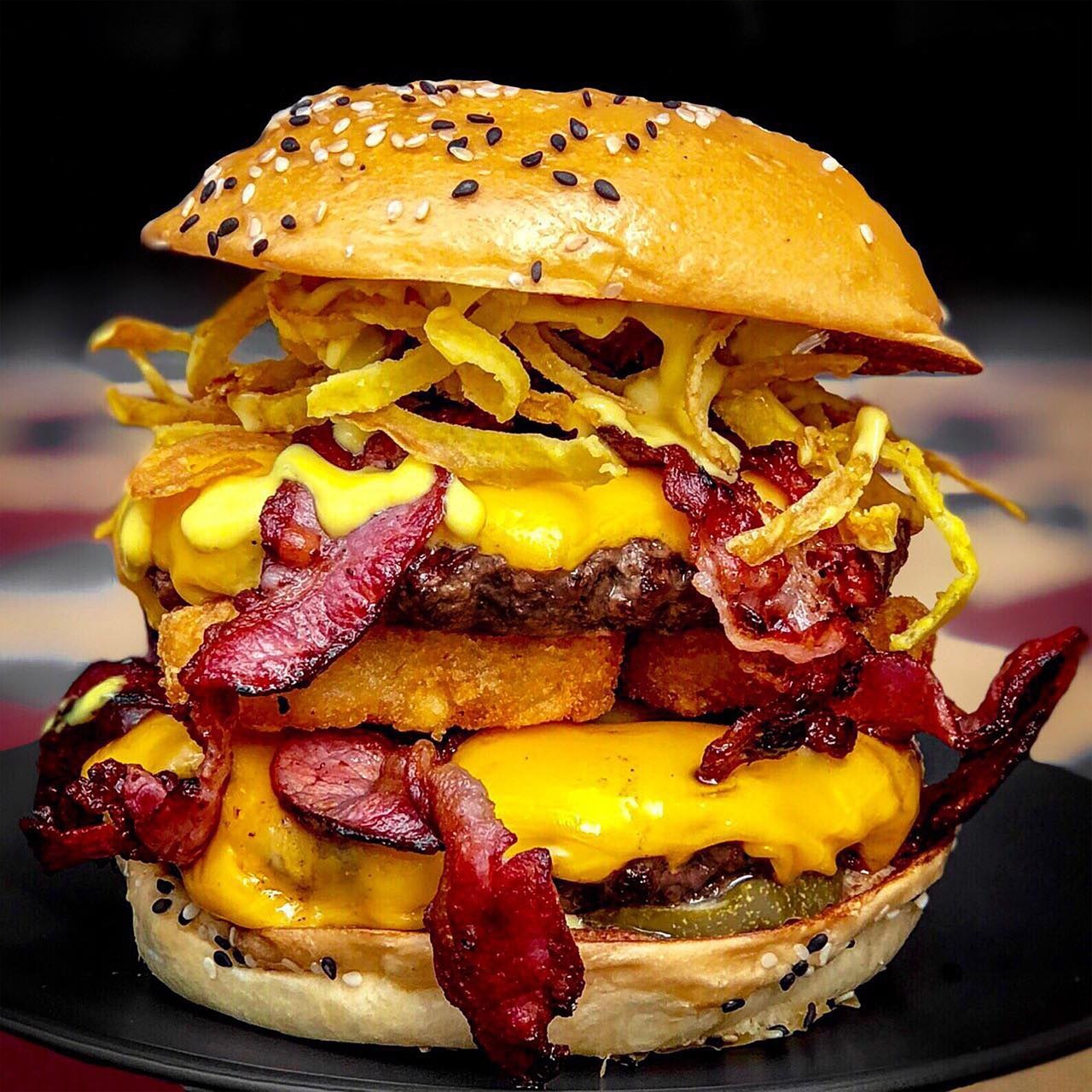 A large cheeseburger with bacon and cheese
AI-generated content may be incorrect.