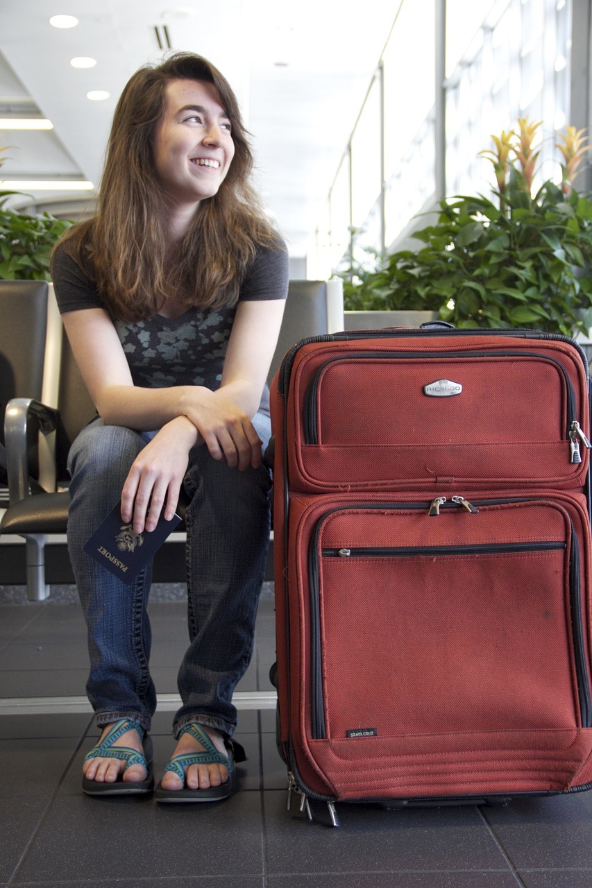 A person sitting next to a suitcase
AI-generated content may be incorrect.