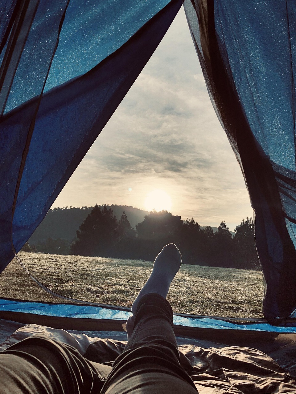 A person's feet in a tent
AI-generated content may be incorrect.