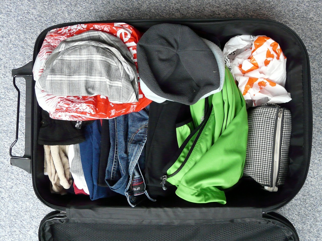 A suitcase full of clothes
AI-generated content may be incorrect.