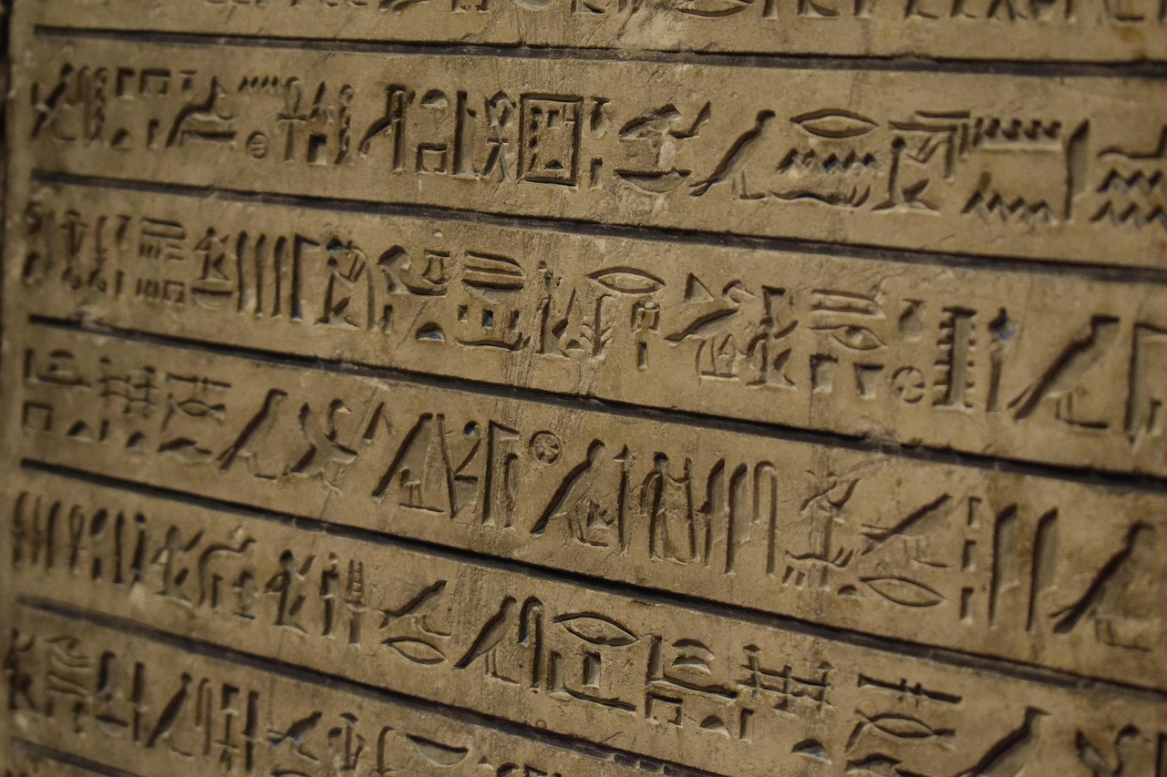 Close-up of a stone wall with egyptian hieroglyphs
AI-generated content may be incorrect.