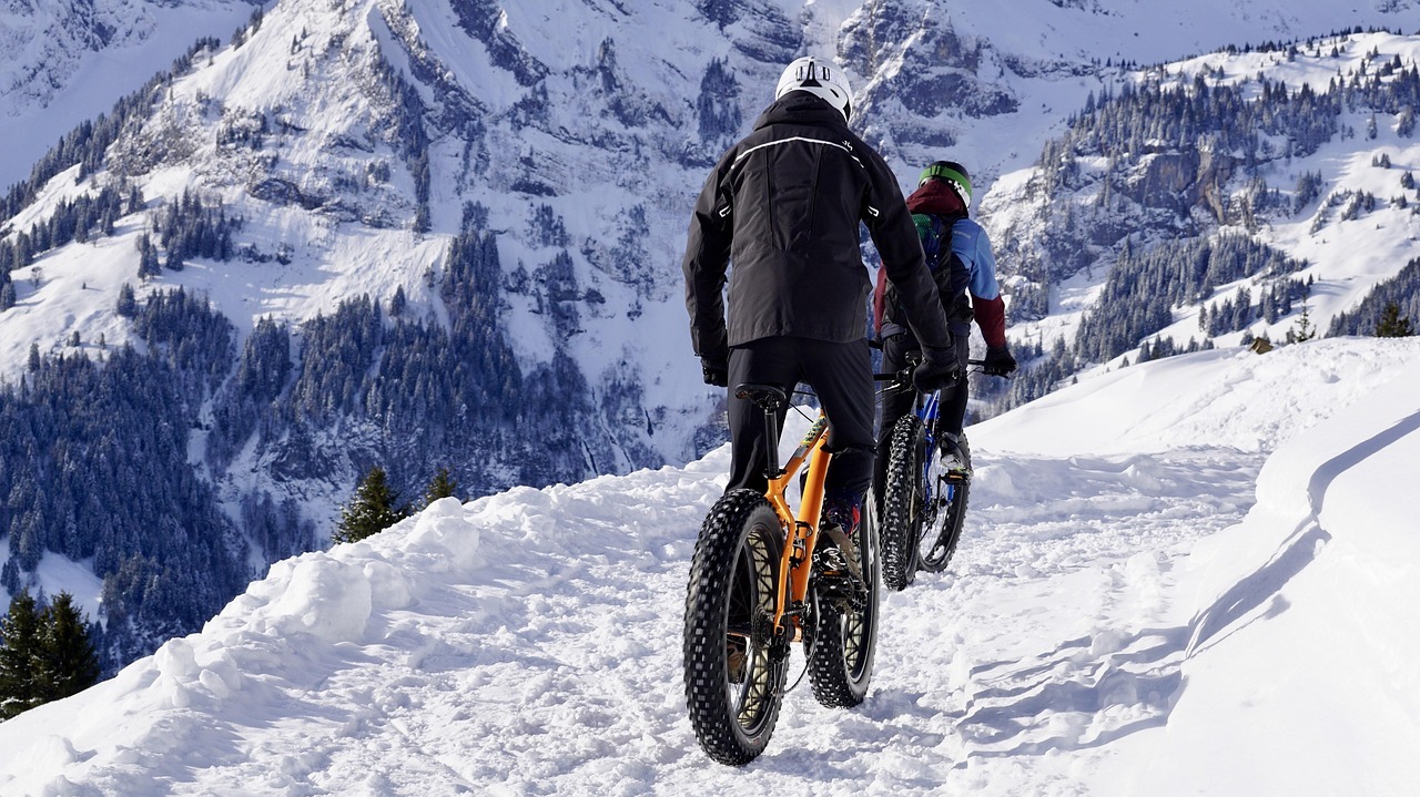 A group of people riding bikes in the snow

AI-generated content may be incorrect.