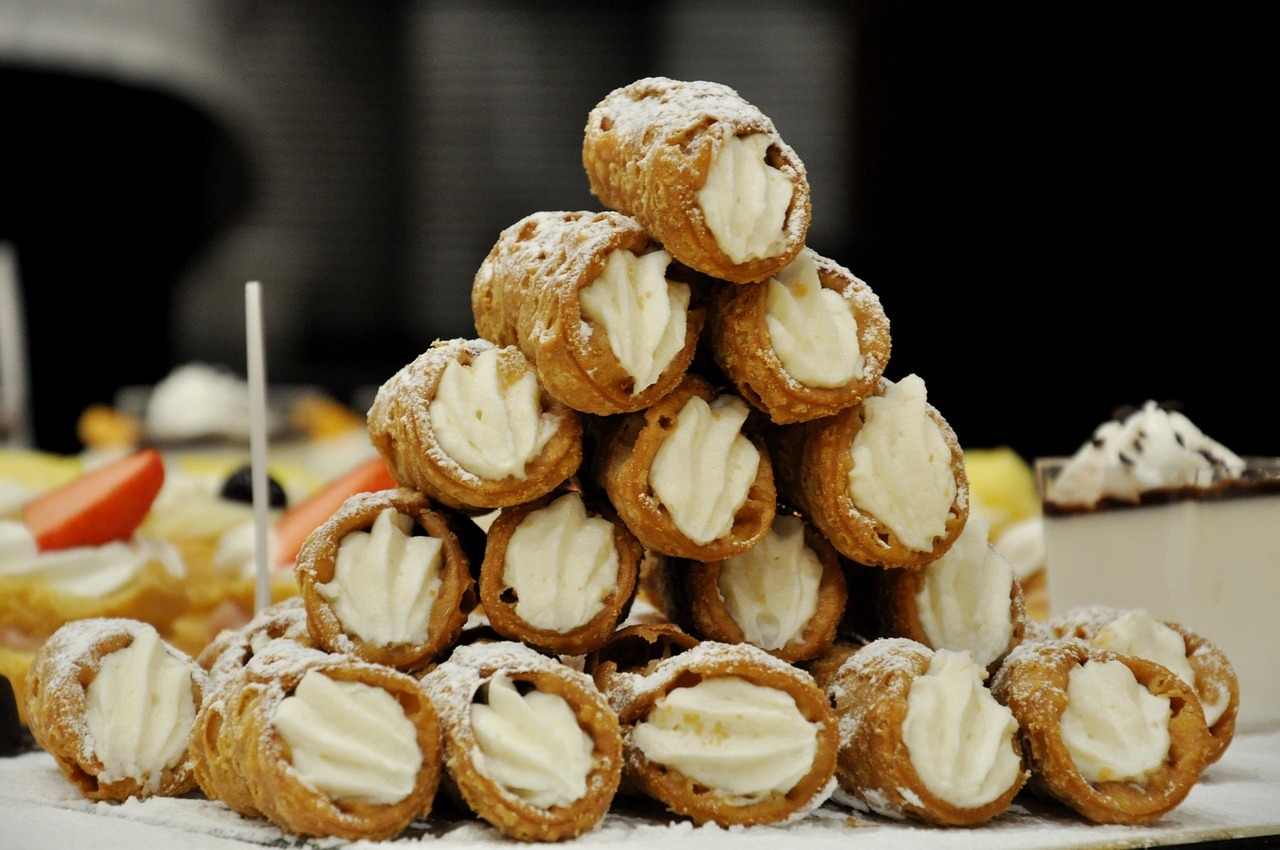 A stack of cannoli with cream filling

AI-generated content may be incorrect.